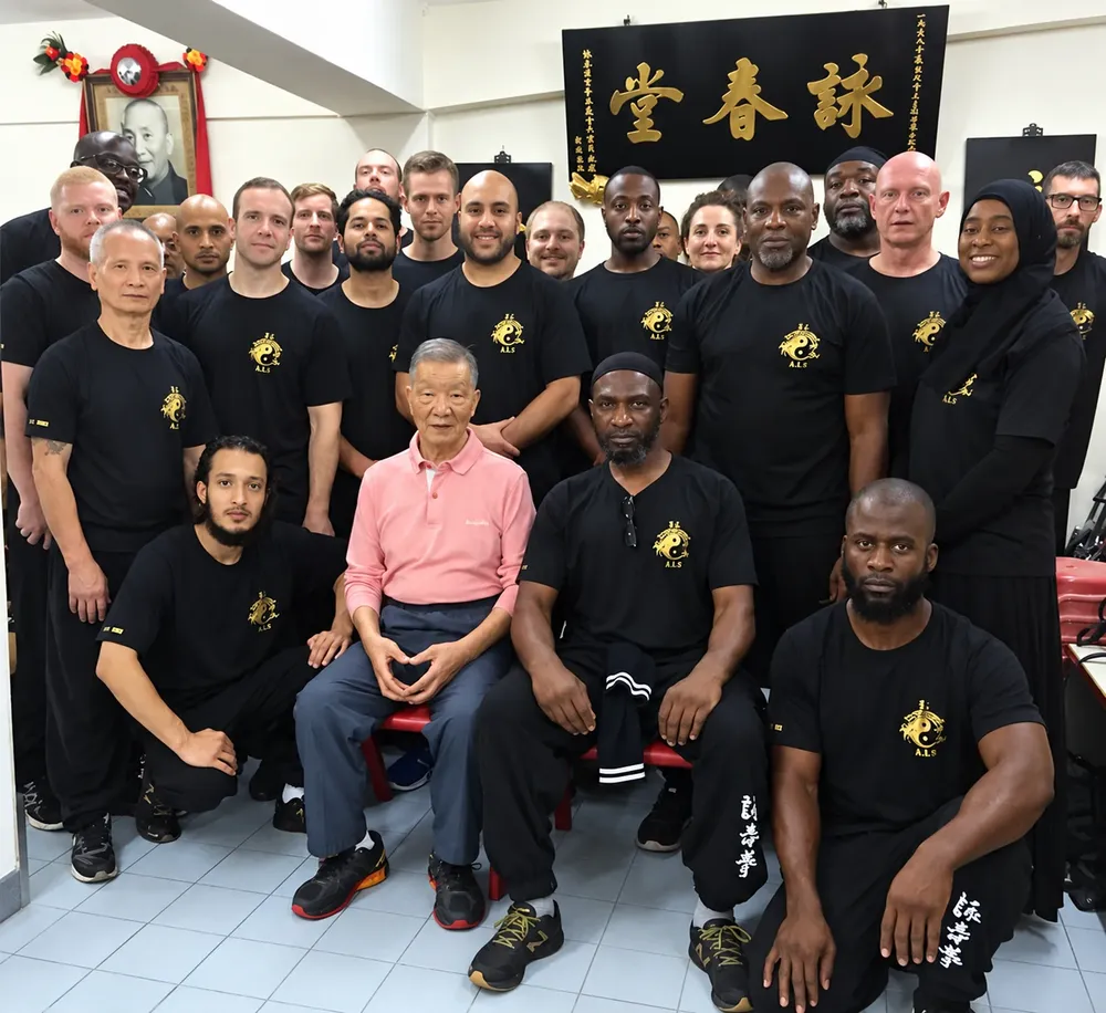 Grandmaster Ip Ching with students and instructors of The Wing Chun School at the Wing Tsun Athletic Association, Hong Kong
